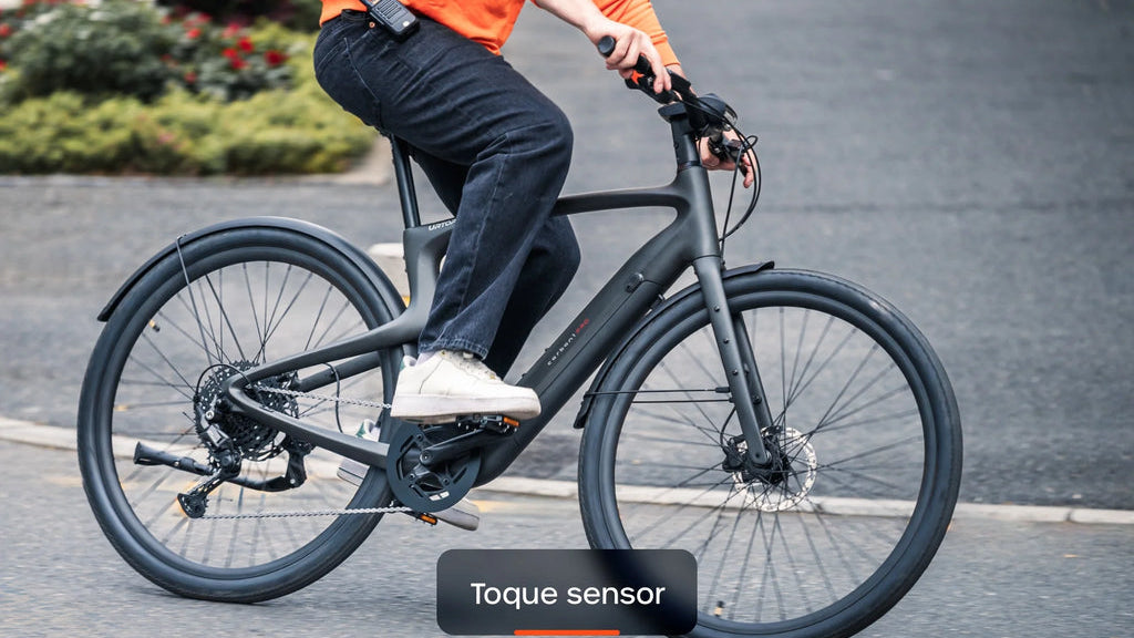 Rider pedaling a Urtopia Carbon 1 Pro on pavement
