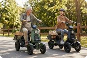 Group of adult riders on EUNORAU S1000 four-wheel electric utility vehicles outdoors