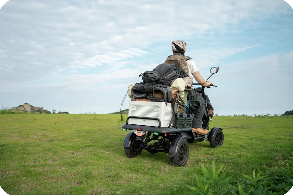 EUNORAU S1000 electric utility vehicle hauling supplies outdoors