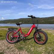 Vtuvia SX20 folding e-bike in Red parked by a lake